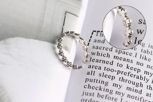 Macro shot of S925 sterling silver hallmark inside the vintage cross ring band