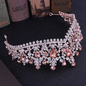 Macro detail of rose gold bridal crown featuring sparkling champagne and clear rhinestones