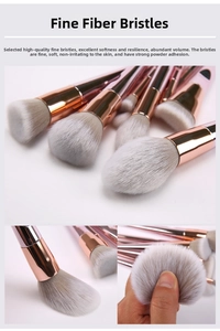 Detail showing soft synthetic fiber bristles and pink handles of the makeup brush set