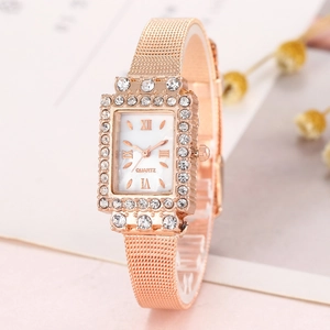 Close-up of women's quartz watch with rectangular rose gold case and rhinestone bezel