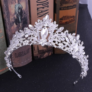 Detailed view of silver bridal crown with leaf designs and sparkling crystal beads