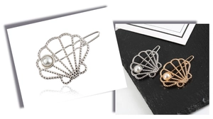 Detailed views of gold and silver seashell hair clips with pearls on dark stone and white base