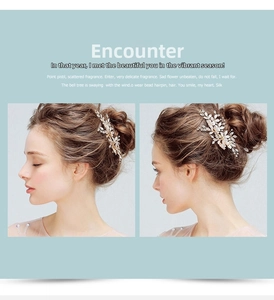 Detail of handcrafted floral bridal hair clip with silver leaves and pearls on hair