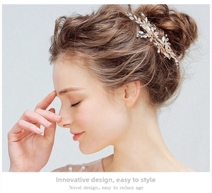 Detailed view of gold leaf bridal hair clip with crystals on an elegant wedding hairstyle