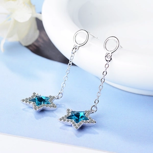 Elegant long silver dangle earrings with blue star-shaped rhinestones for a trendy look