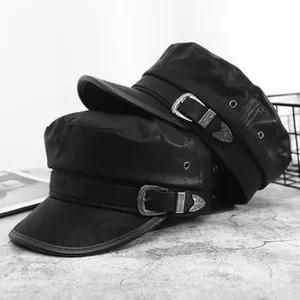 Detail of black faux leather captain hat featuring retro carved silver metal buckle strap