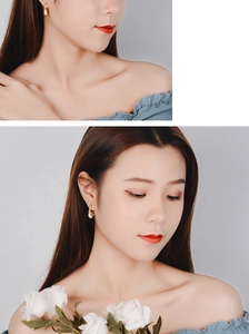 Detailed view of star-shaped gold drop earrings worn by a model with elegant styling