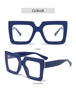 Detail of blue square oversized frames with gold hinges and blue light blocking lenses