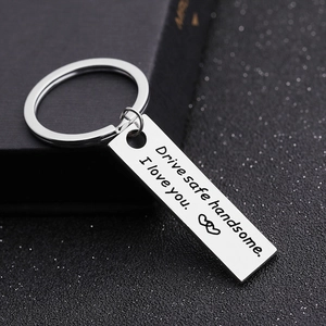 Detailed view of polished metal keychain engraved with Drive safe handsome I love you