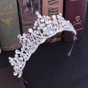 Elegant bridal tiara with sparkling rhinestones and crystal beads on a vintage background