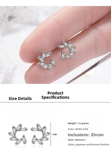 Detail view showing 10mm windmill zircon stud earrings with size guide and on-ear look