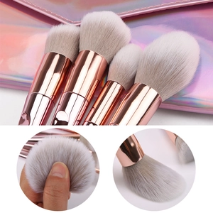 10-piece makeup brush set with rose gold handles and holographic pink storage bag