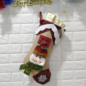 Linen Christmas stocking featuring a 3D snowman mascot and golden gift boxes