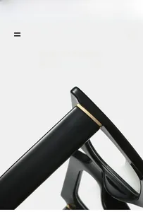 Detail shot of golden metal hinges and premium black glossy frame on blue light glasses