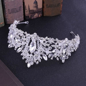 Macro detail of silver bridal tiara featuring leaf motifs and sparkling crystals