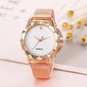 Close-up of rose gold mesh watch with petal-shaped bezel and white shimmering dial