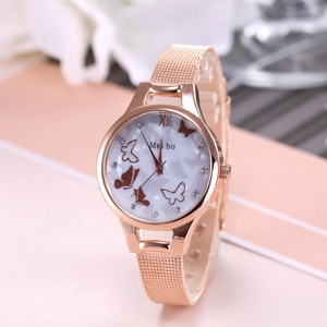 Detail view of rose gold quartz watch with butterfly dial and mesh bracelet strap