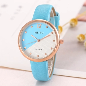 Close-up of MEIBO quartz watch featuring light blue leather strap and rose gold case