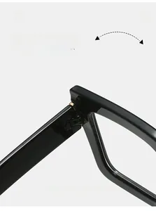 Detail of durable gold metal hinge on black square frames for thousands of folds
