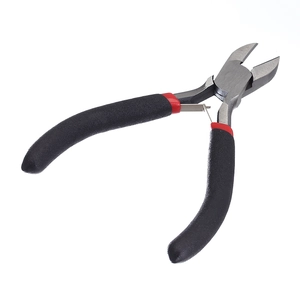 Close-up of diagonal cutting pliers with matte black anti-slip handle and spring reset