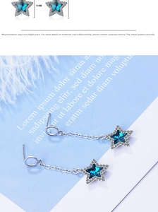 Detail shot of blue star pendant earrings with silver chains and 14mm crystal charms
