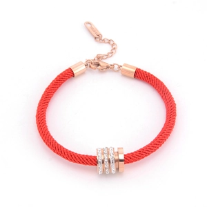 Red braided rope bracelet with rose gold rings and sparkling crystal accents
