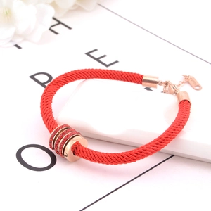 Minimalist red braided rope bracelet with rose gold triple rings and red crystals