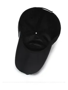 Detailed interior of a black baseball cap showing reinforced seams and stitching