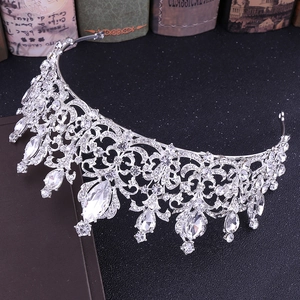 Close-up of Baroque silver bridal crown featuring intricate floral crystal patterns