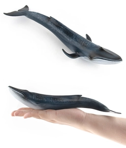 Blue whale ocean animal toy model with white spotted skin detail and hand scale