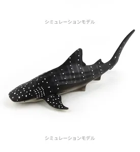 Detailed realistic whale shark toy model with signature white spots and fins on white background