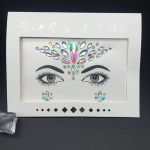 AB Iridescent face crystal sticker with floral forehead jewels and eye accents on card