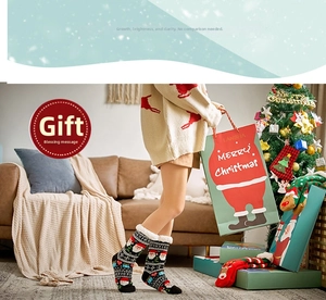 Cozy Christmas slipper socks with Santa motifs and fleece lining in a festive room