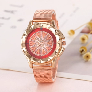 Detail of rose gold ladies quartz watch with red dial and sparkling rhinestone starburst