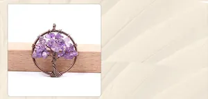 Detailed close-up of handmade tree of life pendant with amethyst and bronze wire