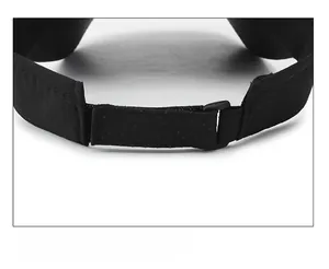 Detail view of breathable fabric and adjustable velcro strap on black sports sun visor cap