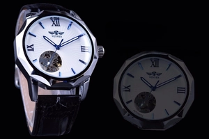 Detail of winner automatic skeleton watch with blue hands and white sunray dial