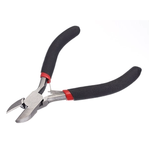 Macro shot of diagonal cutting pliers with red black handle and built-in spring mechanism
