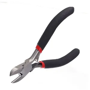 Detail of industrial diagonal cutting pliers with anti-slip black and red handles