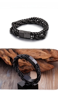Detail of vintage grey double-layer men's bracelet with Cuban chain and mesh weave