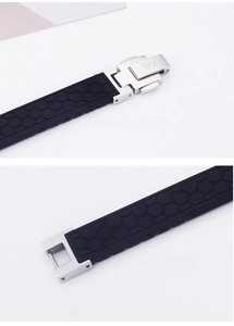 Detail of adjustable black silicone strap with honeycomb texture and silver metal clasp