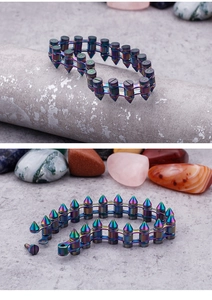 Detail view of colorful punk bullet bracelet with detachable rainbow metal cone spikes