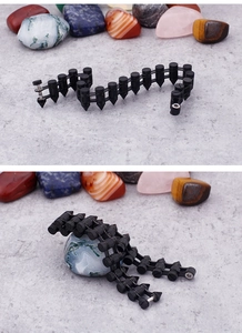 Close-up of black punk rock spike bracelet with detailed mechanical link structure