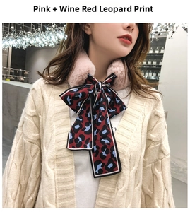 Detail of pink faux fur collar with wine red leopard print silk ribbon bowtie accent