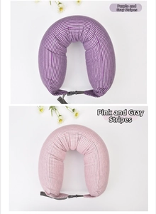 Detail view of U-shaped neck pillows in purple and pink stripes with adjustable buckles