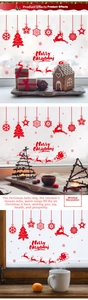 Macro detail of red Christmas reindeer and snowflake static window decals on glass