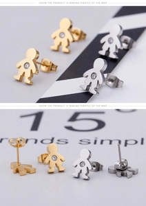 Close-up of polished boy-shaped stud earrings with sparkling cubic zirconia inlay