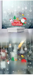 Detail of Santa and reindeer window stickers with Merry Christmas greeting for home decor