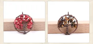 Macro detail of handmade wire wrapped tree of life pendant with copper finish and crystals
