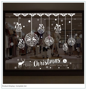 White Christmas window decals with reindeer and snowflakes on a fashion store glass display